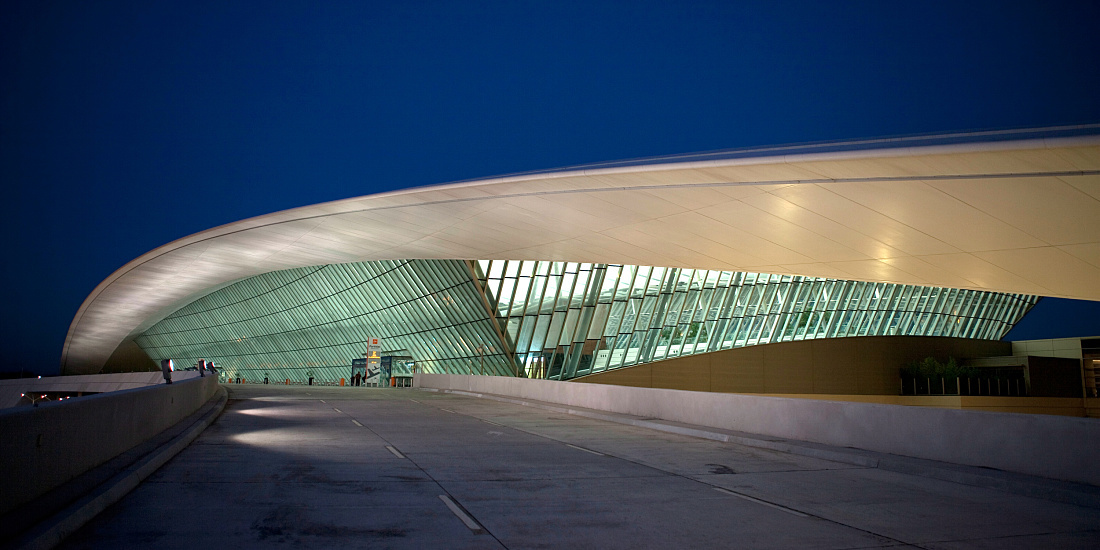 Carrasco International Airport at night, Montevideo, Uruguay. Illuminated, curved roof design.