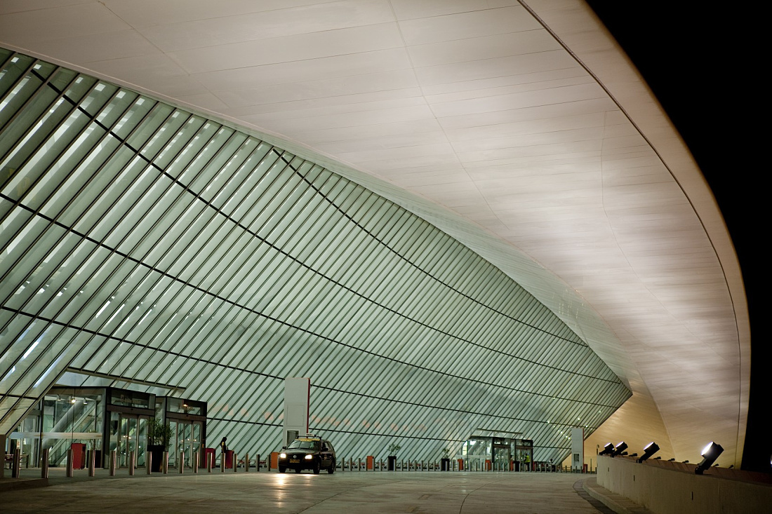 Carrasco International Airports illuminated glass facade in Montevideo, Uruguay.