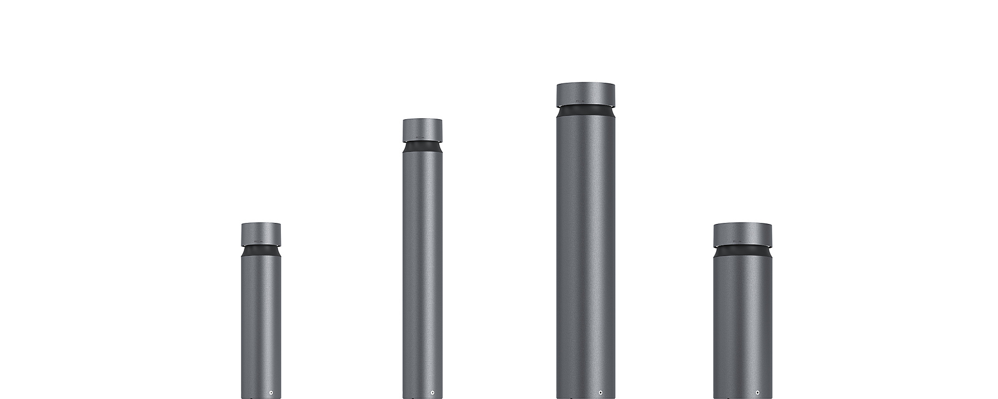 ERCO Castor bollard luminaires in varying sizes for outdoor pathway lighting.