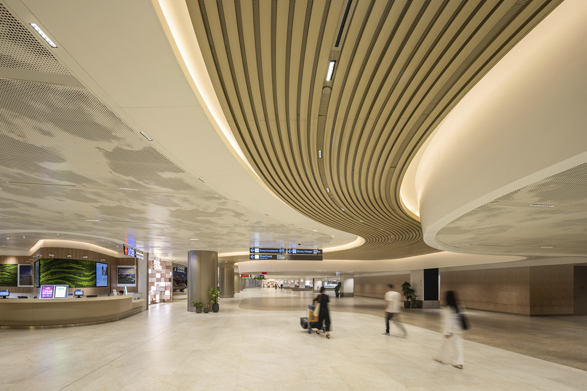 ERCO Compar downlights illuminate Changi Airport's Terminal 2 in Singapore, providing efficient, durable lighting.