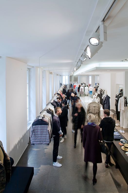 Colette store in Paris, featuring curated products illuminated by ERCO LED lighting.