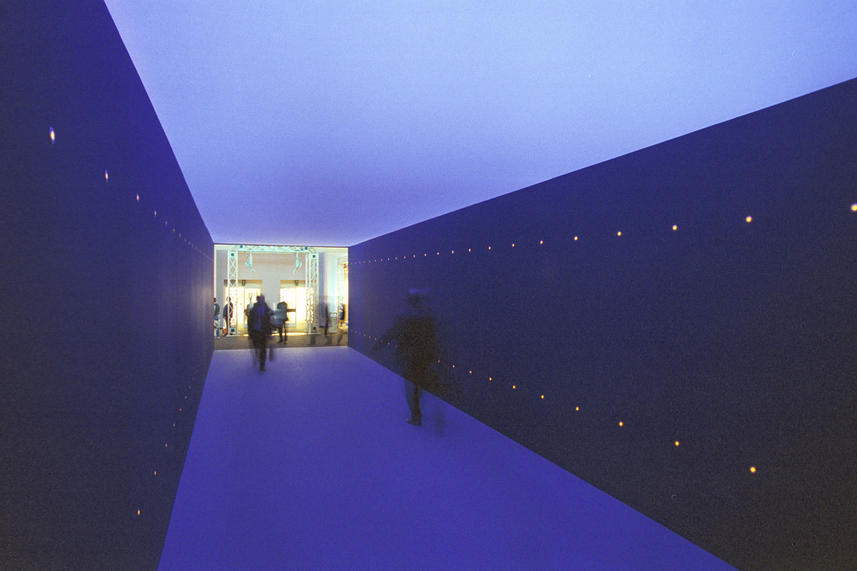 Blue corridor with light points, creating color effect and depth.