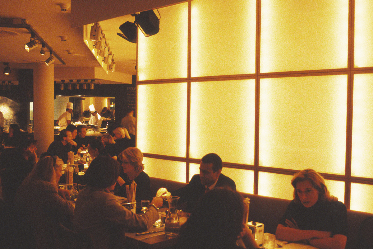 Restaurant lighting with warm colors creates an inviting atmosphere for diners.