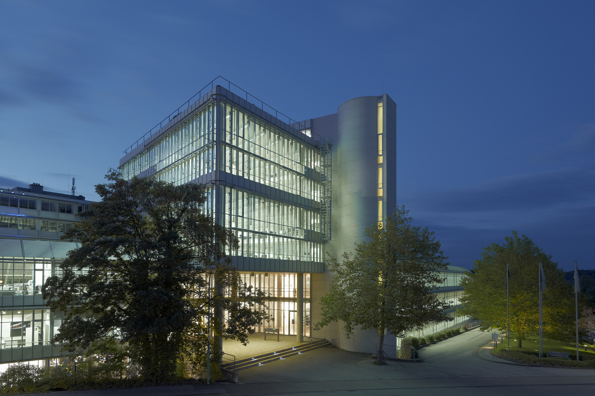 ERCO building at night, showcasing illuminated offices and architectural lighting.