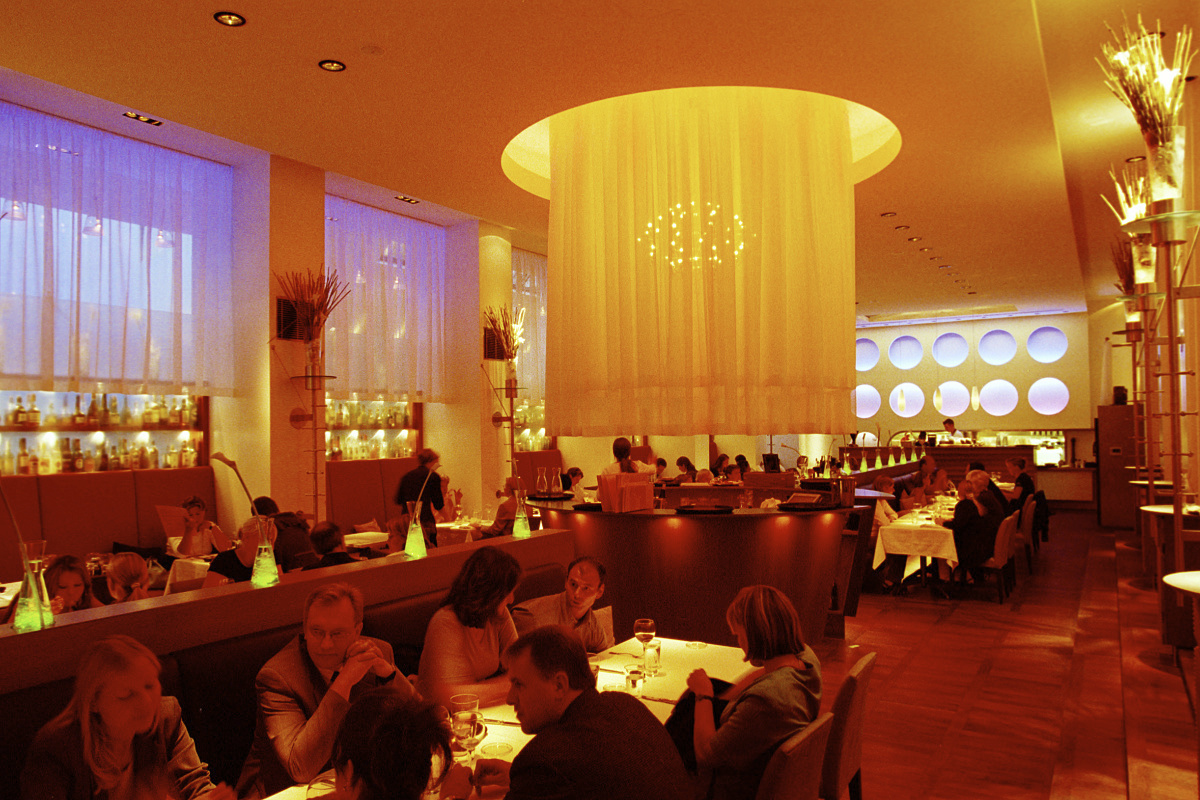 Restaurant lighting using warm white colour temperatures to create an inviting atmosphere.
