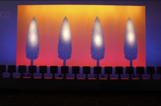 ERCO light design using colored light: Illumination of trees for atmospheric effects.
