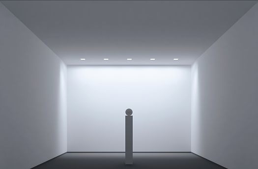 Minimalist gallery space featuring ERCO lighting illuminating a sculpture.