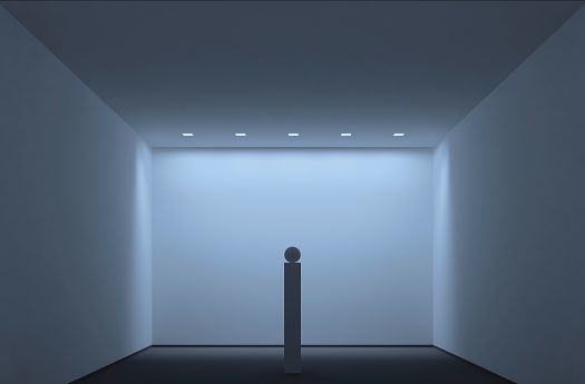 Minimalist room with ERCO downlights illuminating an art object.