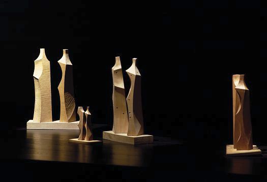 Wooden sculptures demonstrating contrast in brightness and visual perception.
