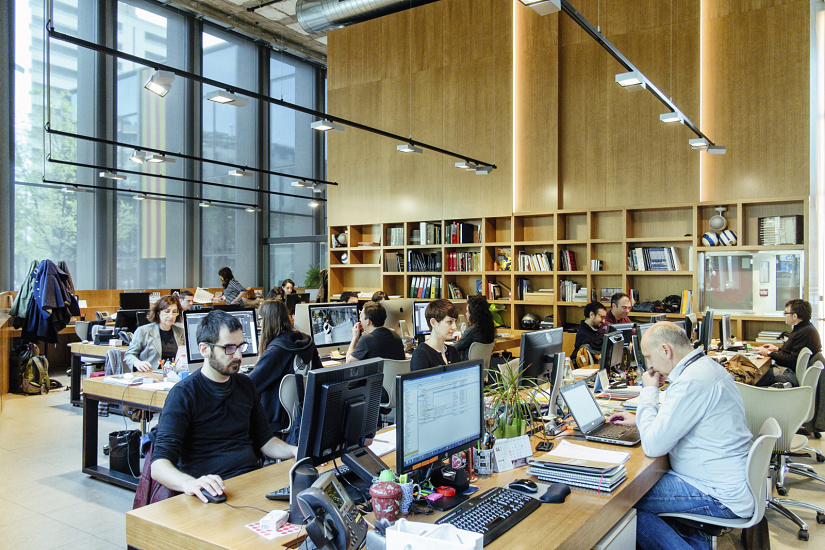ERCO track lighting illuminates a flexible office space, providing ergonomic light for employees.