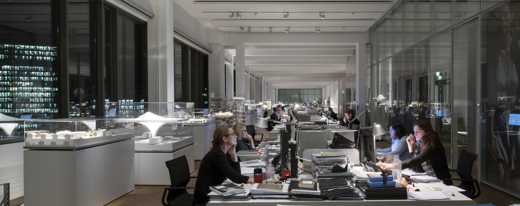 ERCO track lighting with downlights provides flexible, ergonomic office lighting solutions for modern workspaces.