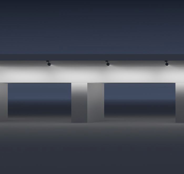 ERCO spotlights illuminate a modern bridge structure, highlighting architectural details.