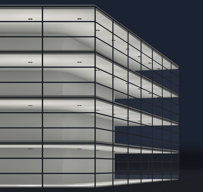 Facade lighting of a modern office building using ERCO lighting solutions.