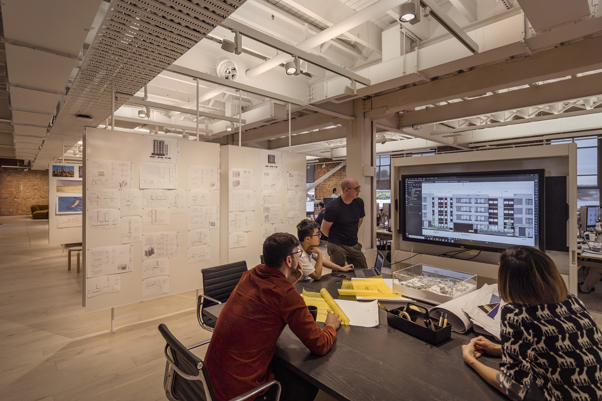 Cox Architecture office in Sydney, featuring ERCO Jilly downlights and Optec spotlights for flexible office lighting.