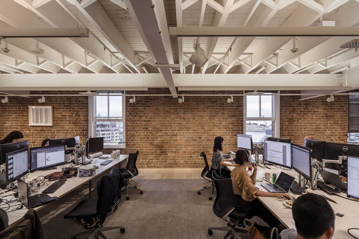 ERCO Jilly downlights illuminate the Cox Architecture office in Sydney, providing flexible office lighting and visual comfort.
