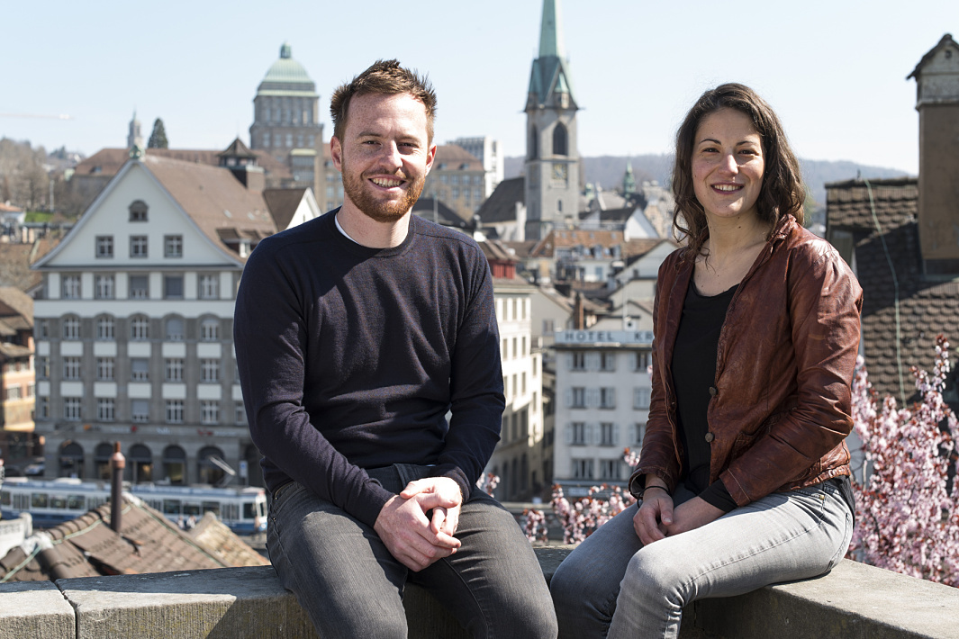Filippo Santoni and Serena Santini, architects for the D.A.T.E. sneaker store in Milan, with Zurich cityscape.