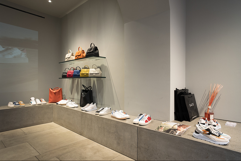 D.A.T.E. sneaker store in Milan featuring ERCO lighting for flexible product display.