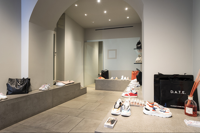 D.A.T.E. sneaker store in Milan, lit with ERCO spotlights for flexible product presentation.