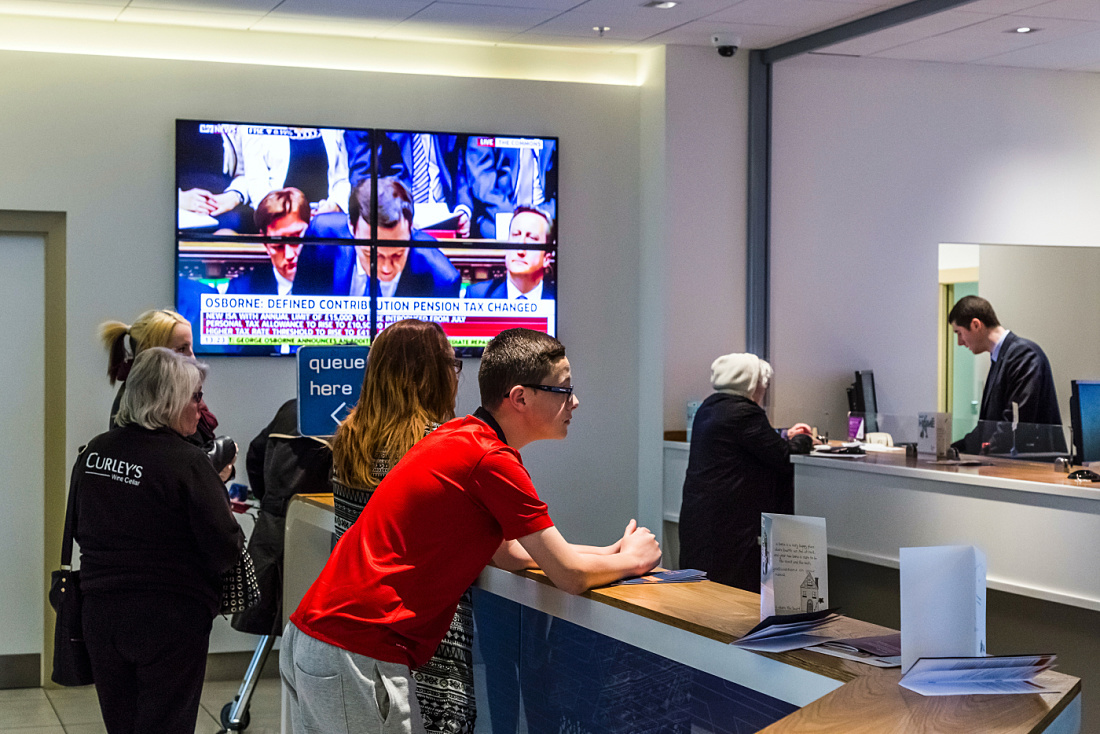 Danske Bank Belfast branch interior featuring ERCO LED lighting for customer orientation.