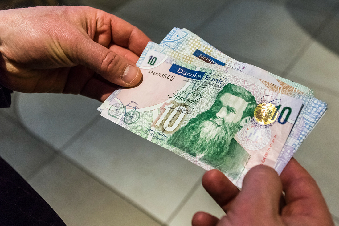 Danske Bank ten pound notes in Belfast, highlighting the banks modern design.