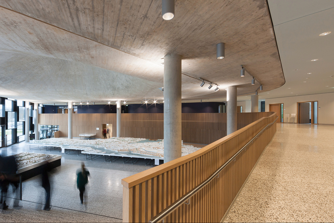 Interior of the Department of Urban Development and Environment in Hamburg, featuring ERCO lighting and city model.