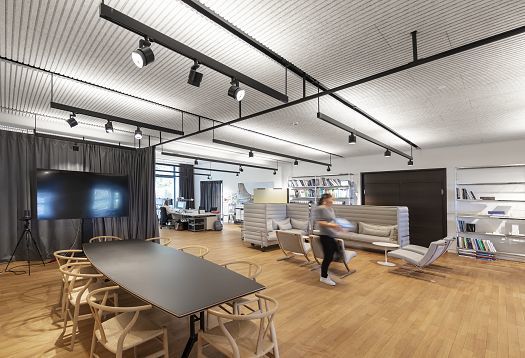 ERCO directional spotlights providing accent lighting in a modern office space.