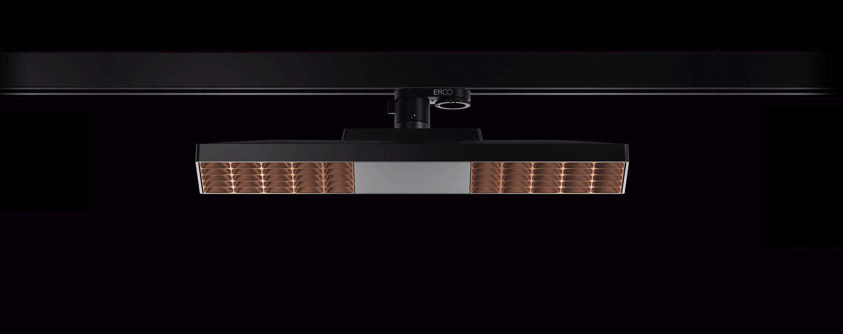 ERCO LED downlight on track, providing flexible office lighting with visual comfort.