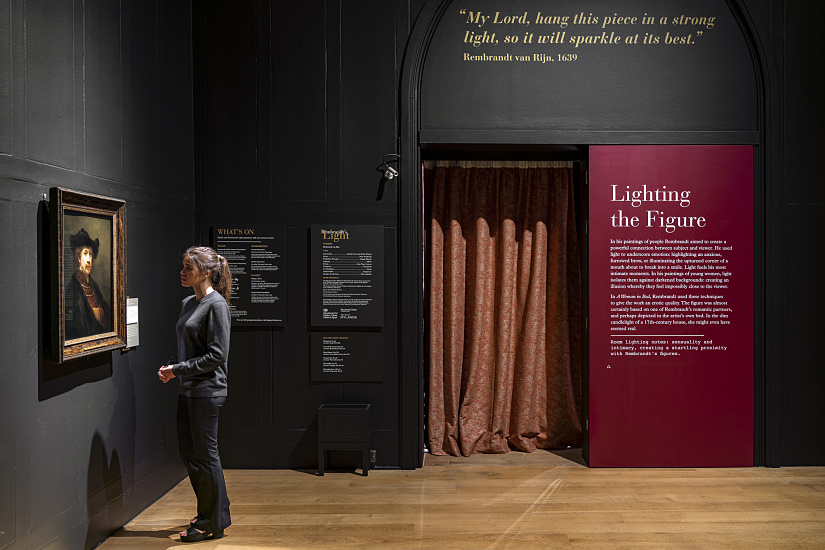 A visitor views Rembrandt's painting at Dulwich Picture Gallery, illuminated by ERCO LED spotlights.