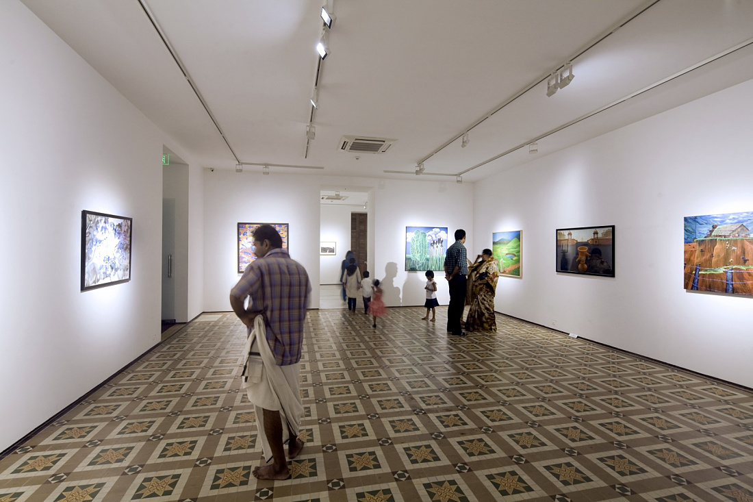 Visitors view art illuminated by Logotec LED spotlights at Durbar Hall, Kochi Biennale art festival.