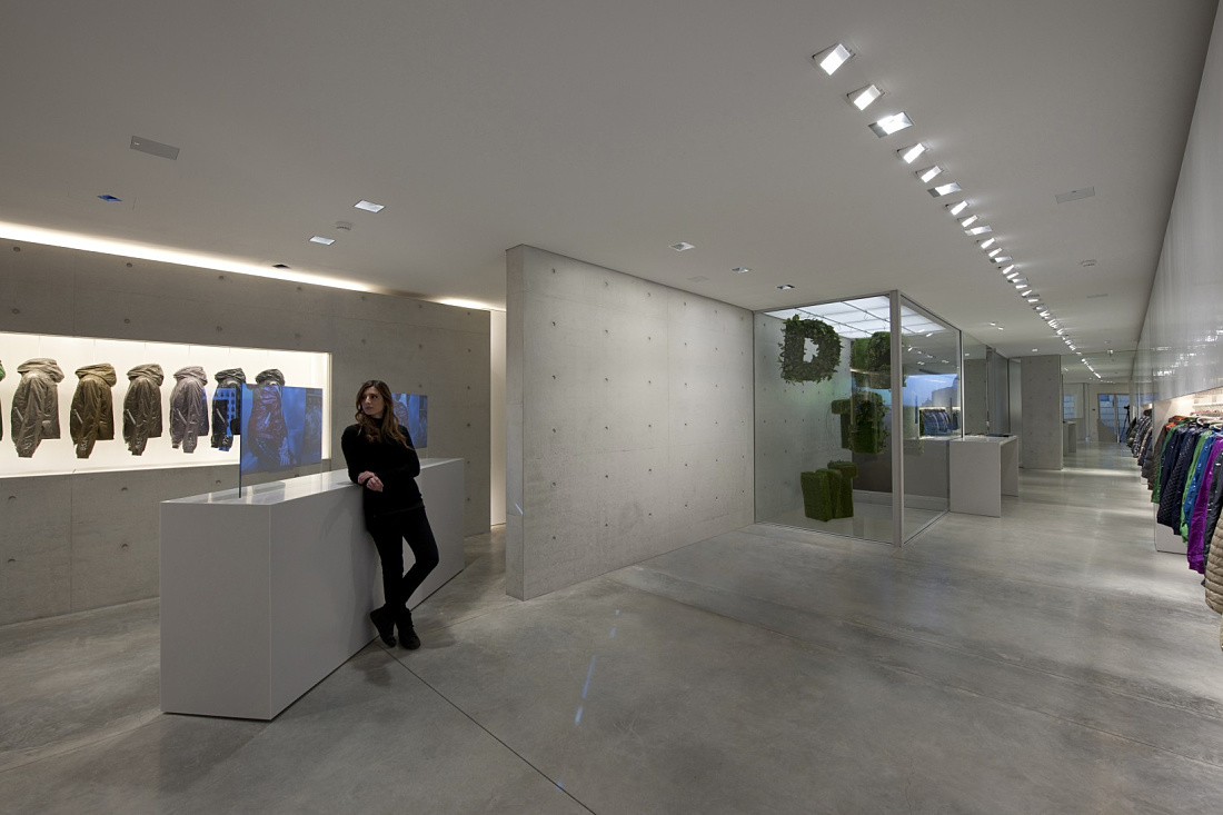 Duvetica showroom featuring ERCO LED lighting, designed by Tadao Ando, highlighting the innovative down jacket brand.