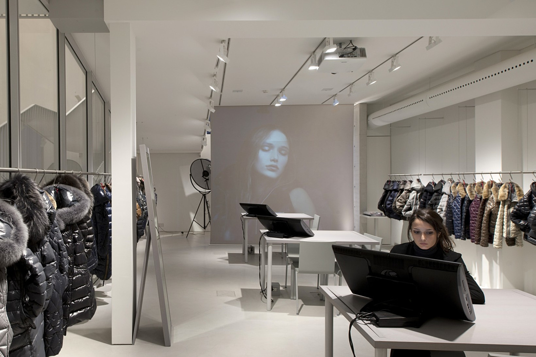 Duvetica showroom featuring ERCO LED lighting and down jackets in Milan, designed by Tadao Ando.