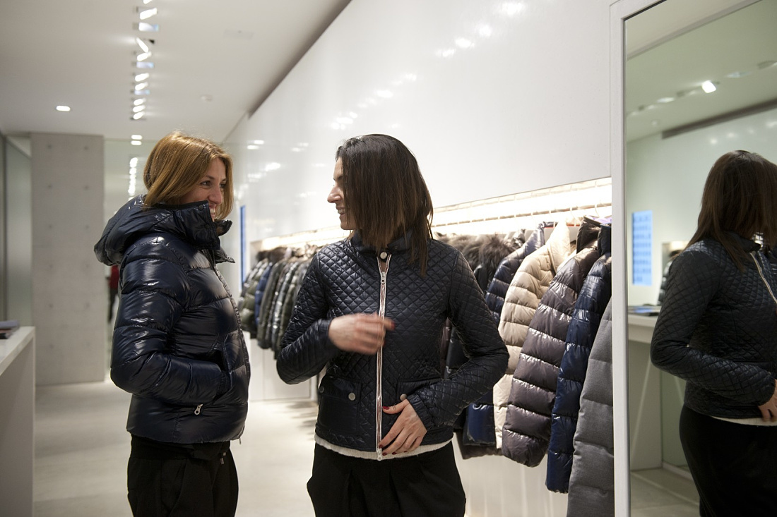 Duvetica down jackets in showroom, illuminated by ERCO LED lighting.