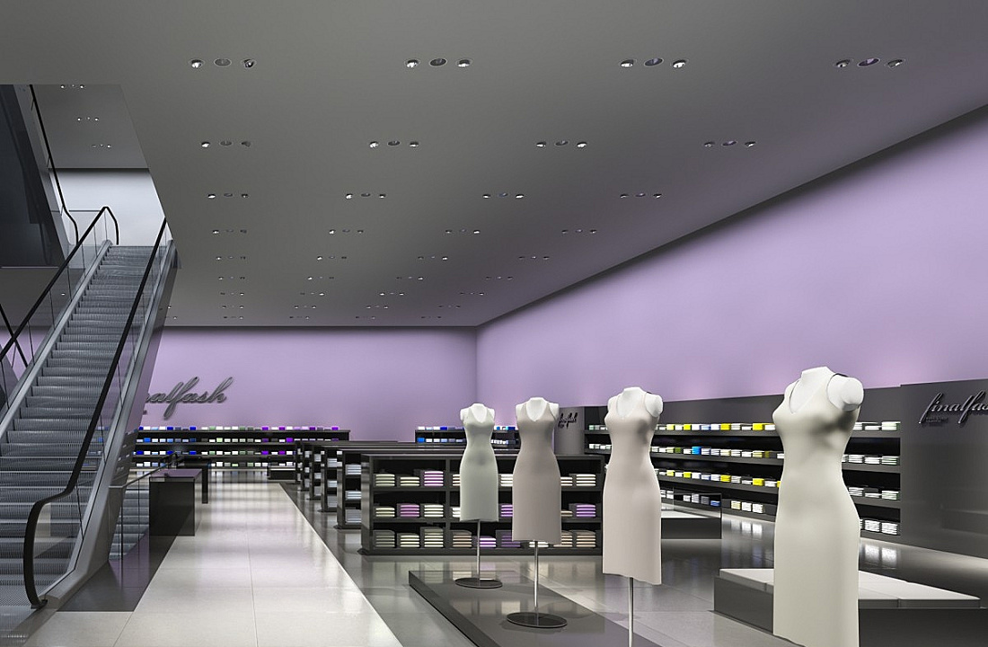 Bright ERCO LED lighting in a modern clothing store featuring mannequins and an escalator.