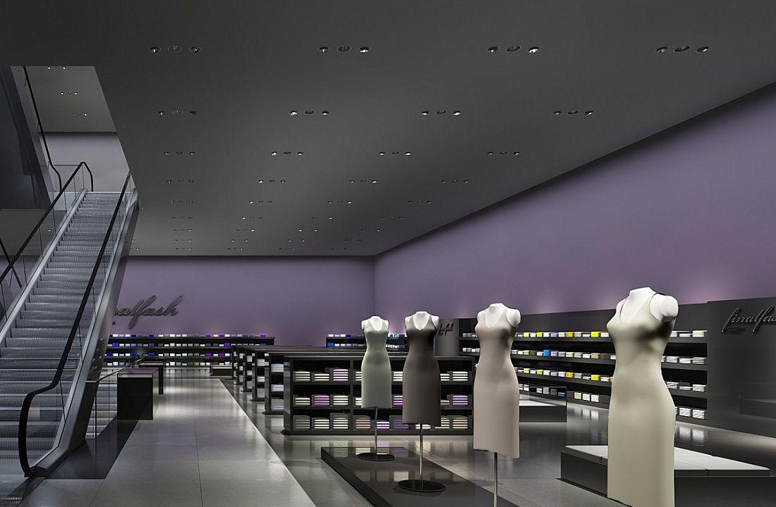 ERCO LED downlights and accent lighting illuminate clothing displays in a retail store.