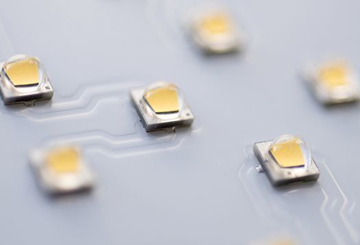 Close-up of ERCO LED chips on a circuit board for efficient lighting solutions.