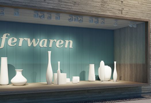 Shop window display featuring vases illuminated by ERCO spotlights.