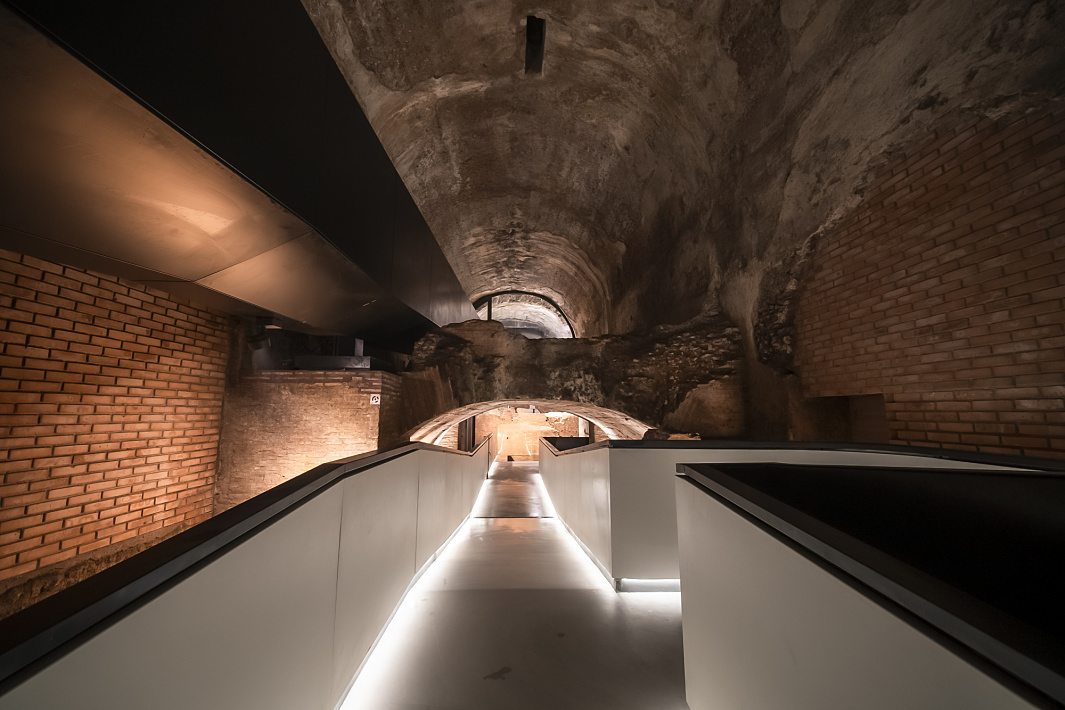 ERCO LED lighting illuminates the Domus Aureas underground walkway, blending ancient brickwork with modern design.
