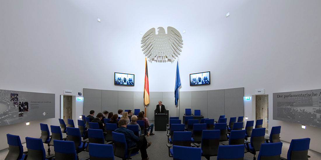 Exhibition space at Deutscher Dom church, Berlin, featuring ERCO Optec spotlights illuminating the exhibit.
