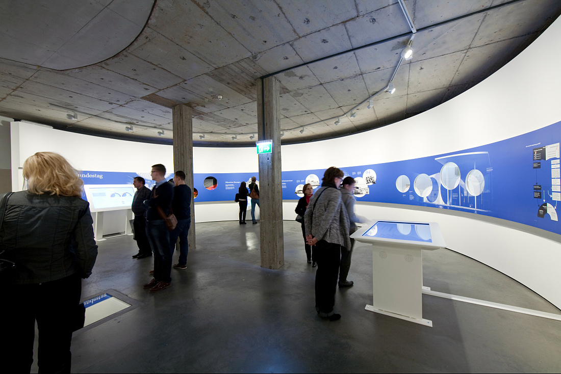 Visitors at the Deutscher Dom church exhibition in Berlin, lit by ERCO Optec spotlights.