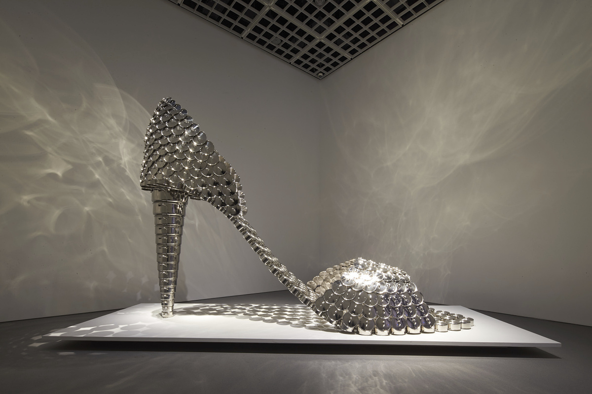 Metal high heel sculpture illuminated by ERCO spotlights at the Amorepacific Museum of Art.