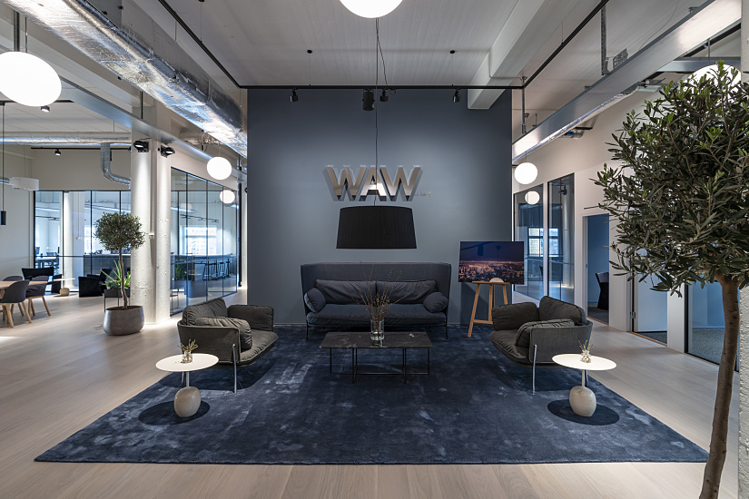 Fabege's WAW lounge featuring ERCO LED lighting in a modern Stockholm office space.