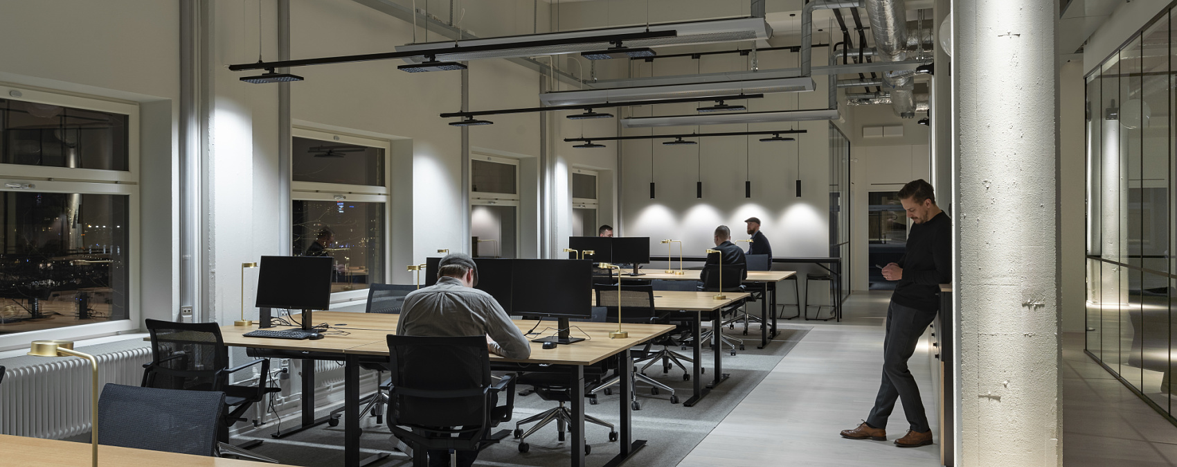 ERCO Jilly downlights illuminate Fabege's modern Stockholm office, enabling flexible work.