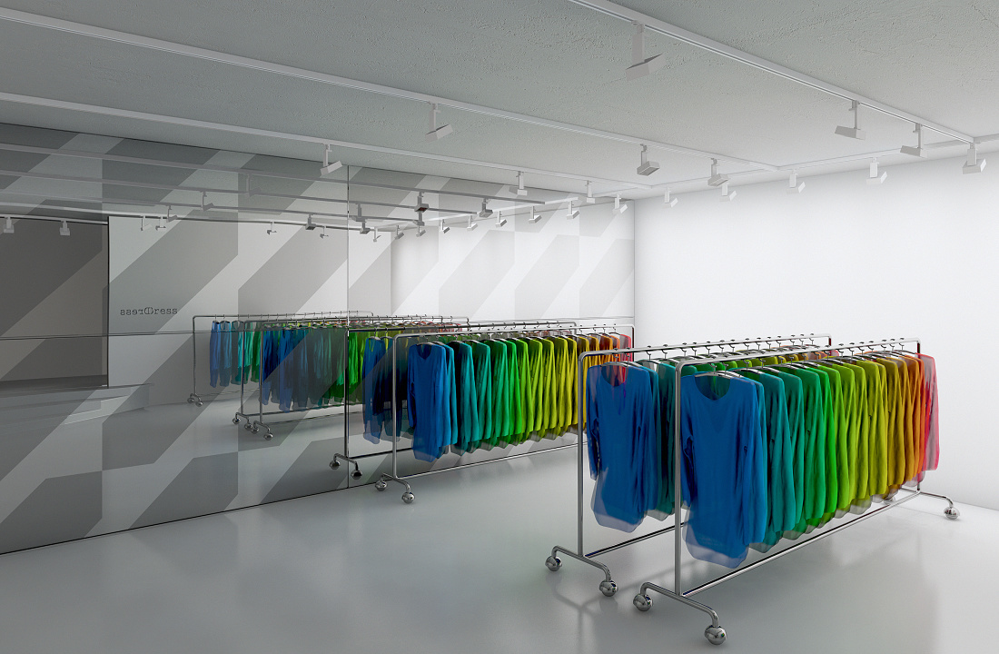 Illuminated clothing racks with colorful garments in a fashion store, accented by ERCO spotlights.