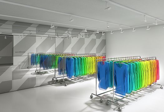 Fashion clothing on racks in a store, illuminated by ERCO lighting for product presentation.