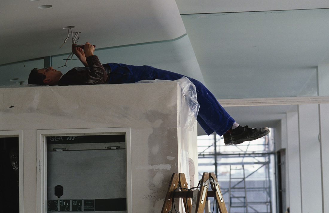 Electrician installing ERCO LED lighting at the Federal Chancellery, Berlin.
