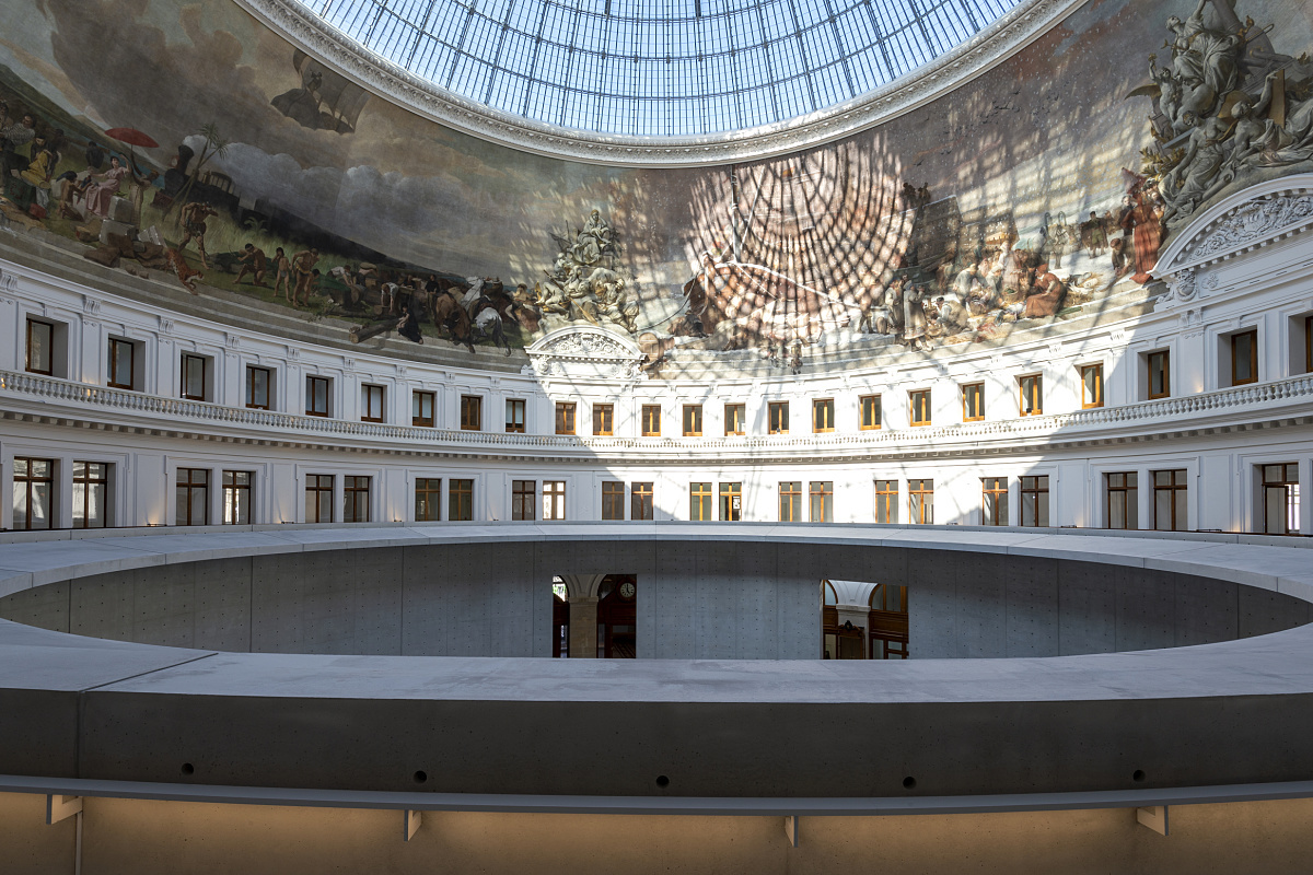 Interior of the Bourse de Commerce in Paris, featuring ERCO LED lighting and mural under the glass dome.