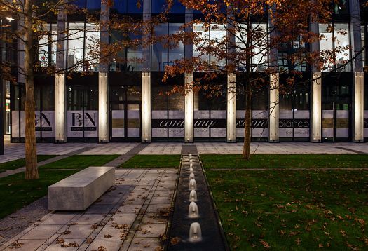 Florentinum office building in Prague with ERCO outdoor lighting for orientation and amenity.