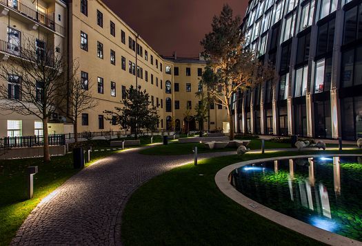 Florentinum office building in Prague with ERCO outdoor lighting for orientation and amenity.