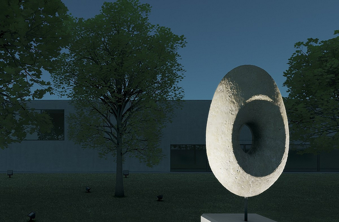 Illuminated sculpture in the foreground with trees and building facade in the background. ERCO lighting design.
