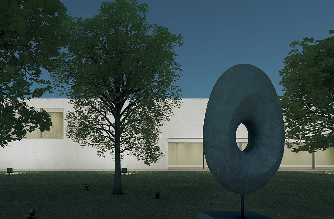 Illuminated sculpture in the foreground, trees in the middle ground, and facade in the background. ERCO lighting design.
